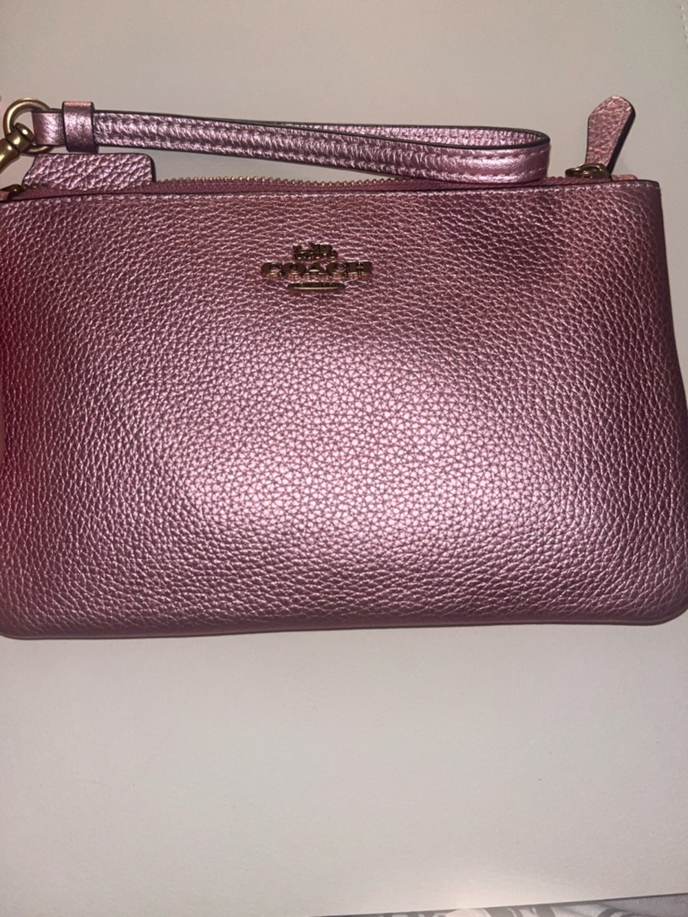 Coach Metallic Rose Pink Wristlet with Gold Hardware.